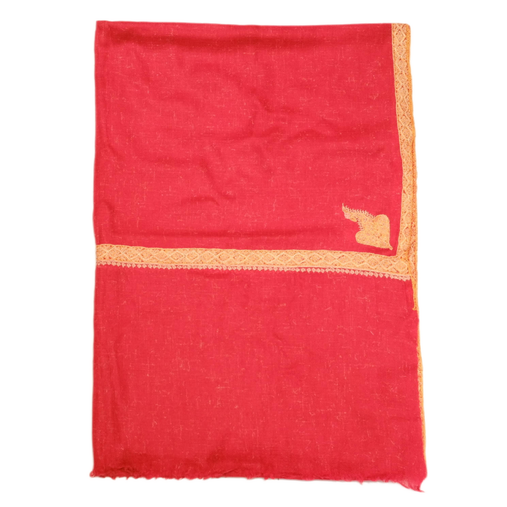 Red fabric with gold border on a white background